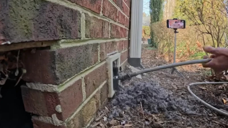 Dryer vent cover on a brick home exterior serviced by our St. Augustine dryer vent cleaning team